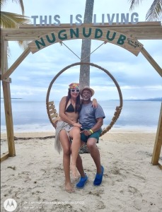man and woman on swing