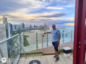Panoramic view of Miami skyline and ocean from a high-rise balcony.