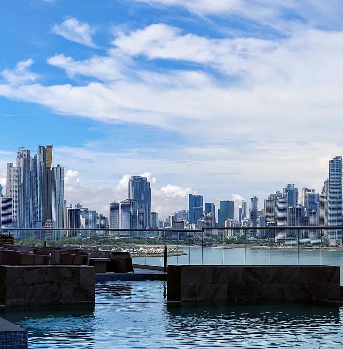 Relaxing pool with city skyscrapers in the background.