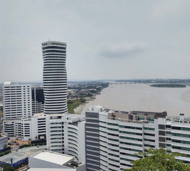 Skyscraper and river view in a modern cityscape from above.